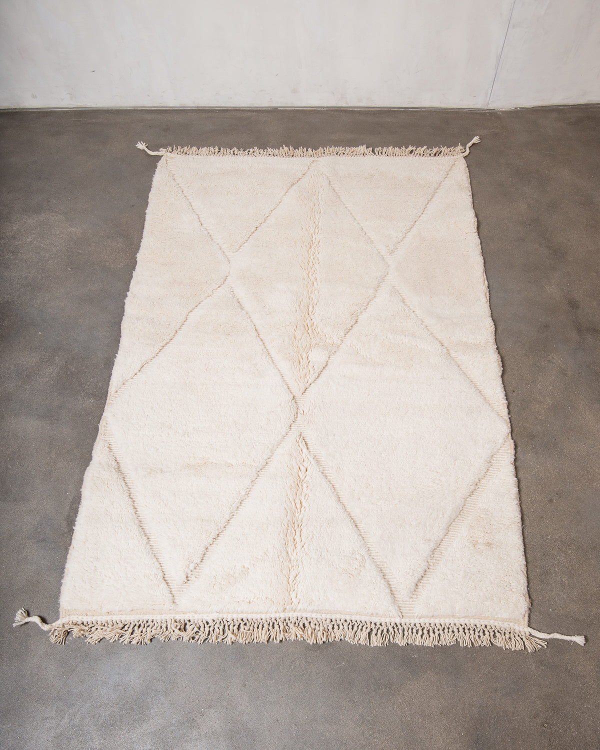Modern, designer, handcrafted Berber rug from Morocco. Beniourain carpet with minimalist design, natural wool pile and a fluffy texture.